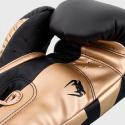 Venum Elite boxing gloves black / gold